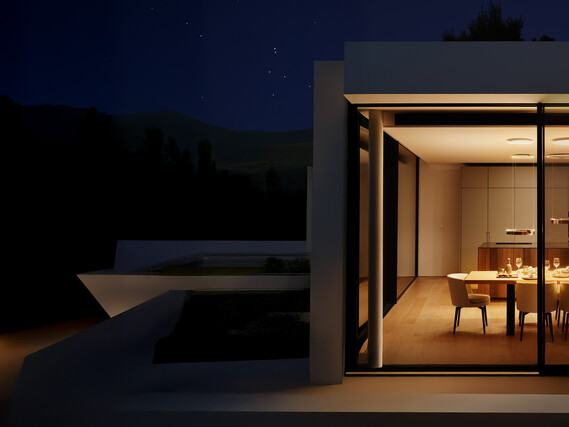 Occhio Mito sospeso pendant LED luminare over dining table at night